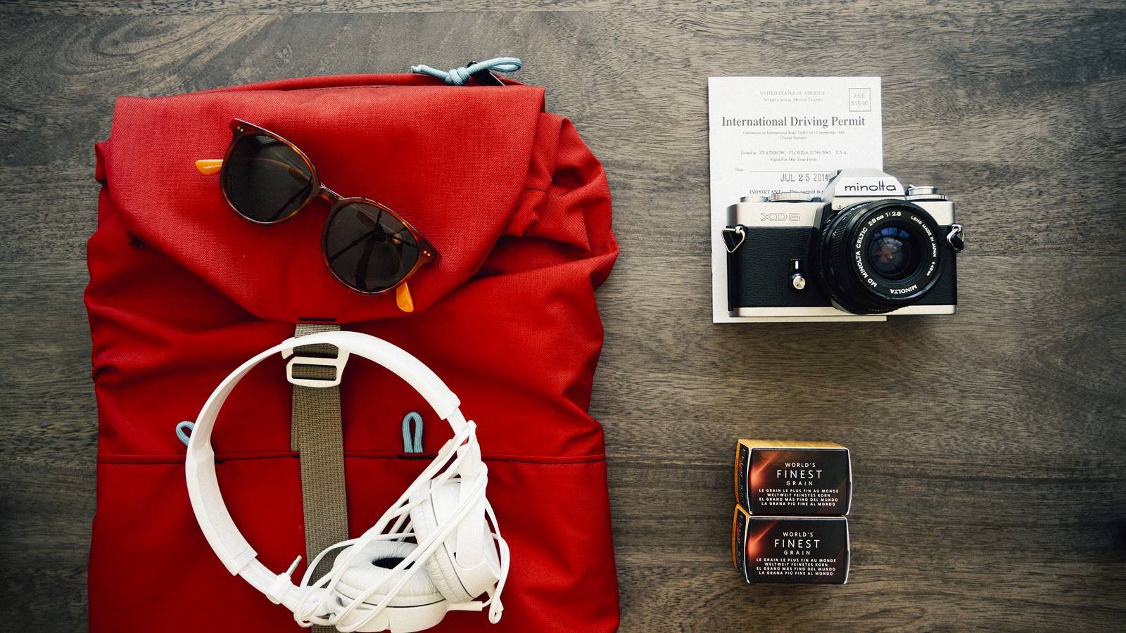 Travel backpack and packing items for mountain trip planning